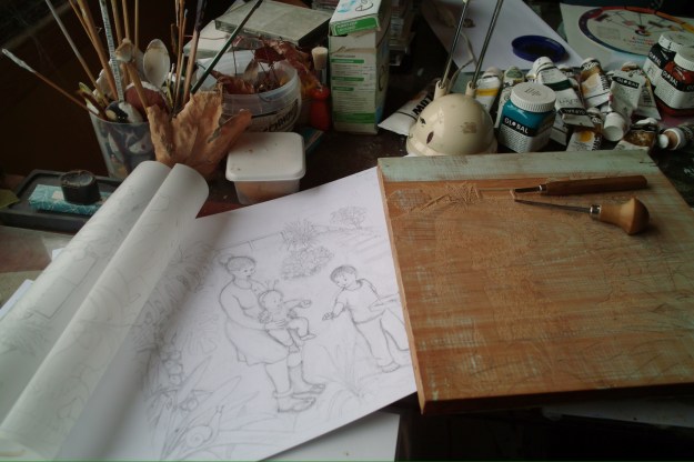 Here's the wood block for the 'snails' page. Those are my wood carving tools sitting on the wood block.